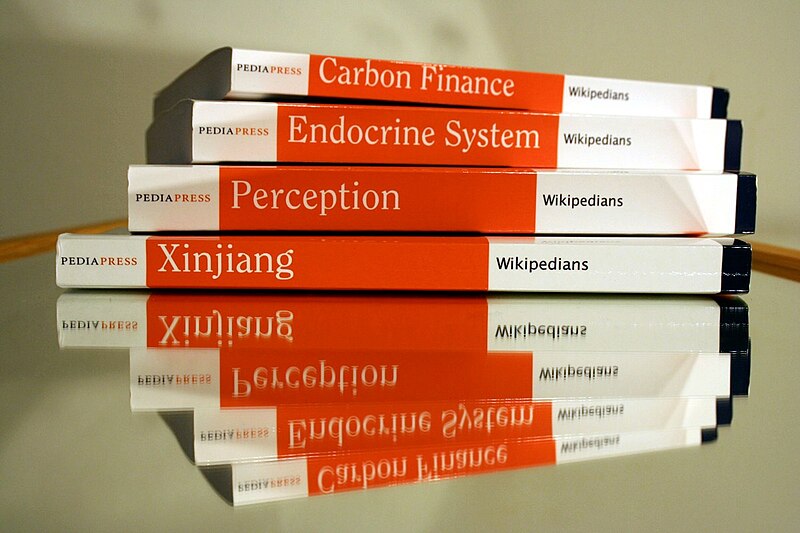 File:Pile of PediaPress Books - spine view.jpg