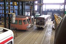 Hall of transportation section, parts of tram Škoda 14 T on left, modernized metro wagon 81-71 on right