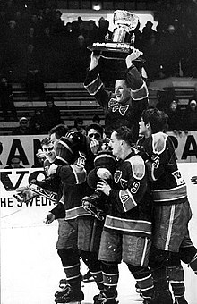 Porin Karhut player holding the Kanada-malja after winning the Finnish Championship of ice hockey in 1965 Porin Karhut 1965.jpg