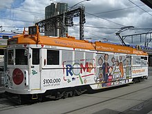 SW5 728 in advertising livery on the corner of Flinders & Market Streets in 2007 SW5.728FlindersStreet.jpg