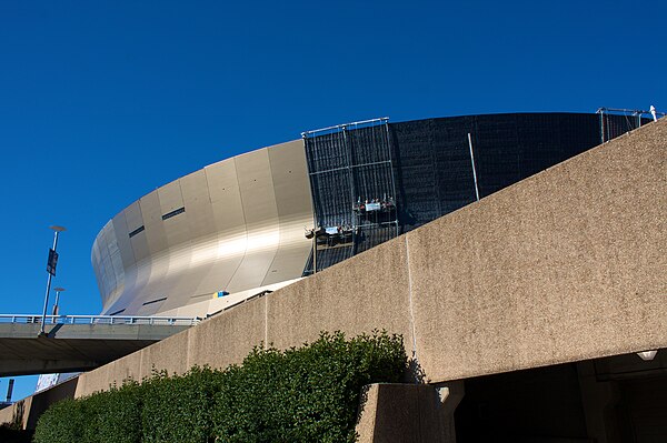 Construction workers replace the Superdome's 30-plus-year-old siding.