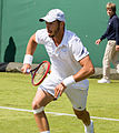 Tim Pütz competing in the first round of the 2015 Wimbledon Qualifying Tournament at the Bank of England Sports Grounds in Roehampton, England. The winners of three rounds of competition qualify for the main draw of Wimbledon the following week.