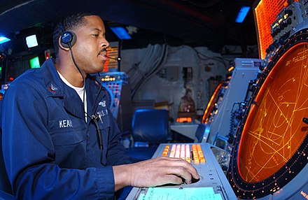 An air traffic controller 2nd class monitors a radar display for returning helicopters on the USS Bonhomme Richard. US Navy 030323-N-3181R-008 Air Traffic Controller 2nd Class Torie Kearney from San Diego, Calif., waits for AV-8B Harriers to return to USS Bonhomme Richard (LHD 6).jpg