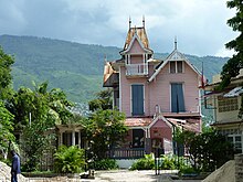 Gingerbread house at Universite Episcopale d'Haiti was left standing when the three-story classroom building adjacent to it collapsed in an earthquake. Universite Episcopale d'Haiti (UNEPH).jpg