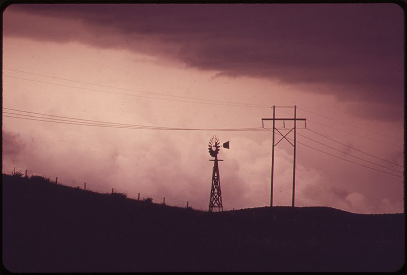 File:WINDMILL AND POWER LINES NEAR THE DAVE JOHNSTON POWER PLANT - NARA - 549213.jpg