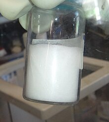 Frozen zinc bis(trimethylsilyl)amide. This compound melts at 12.5 degC. Zinc bis(trimethylsilyl)amide.jpg