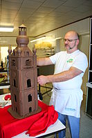 A chocolatier making a chocolate tower