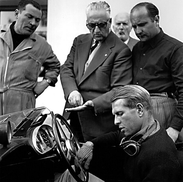 Collins with Ferrari (centre background) shortly before the 1957 Mille Miglia