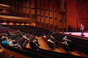 Comedians and audience at Wikimedia 2014 in the Barbican Hall, London.