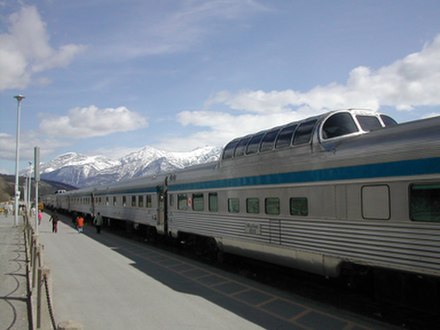 An Eastbound VIA Rail Canada 'Canadian' service from Vancouver, British Columbia to Toronto, Ontario pauses for an extended stop at Jasper in the Rocky Mountains in May 2006. A high level observation car is nearest the camera.