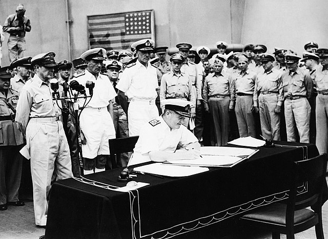Tokyo Bay – Surrender of Japanese aboard USS Missouri. Admiral Sir Bruce Fraser, commanding British Pacific fleet, signs the Instrument of Surrender o
