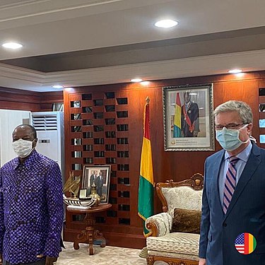 President Alpha Conde meets with U.S. Ambassador to Guinea Simon Henshaw to discuss the COVID-19 pandemic while both practice social distancing. Alpha Conde and Simon Henshaw - COVID-19.jpg
