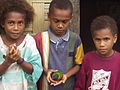 Ambae children with pet lorikeet