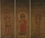 A red robed deity flanked by two attendants.