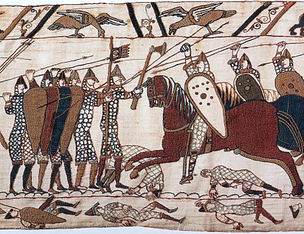 1066 - ויליאם הראשון כובש את אנגליה מידיו של הרולד השני. בסצנה זו משטיח באיה, חיילים נורמנים תוקפים חומת חיילים אנגלו-סקסונים