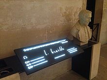 A stone bust of Braille with an audiotronic memorial plaque