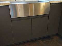 The element above the pair of doors is a flipped drawer front that is cut to size.