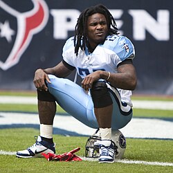 Titans running back Chris Johnson was known for his speed, which enabled him to rush for 2,006 yards in 2009, plus make himself a valuable receiver. Chris Johnson sitting on his helmet.jpg