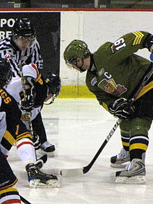 Hodgson (right) faces off during a game against the Barrie Colts. Cody Hodgson faceoff 02-2010a.jpg