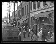 Crowd gathers in Old Chinatown after a police raid on gambling dens, 1938. Crowds gather in 700-block North Alameda street after police raids in Los Angeles, Calif., 1938.jpg