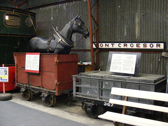 A preserved Dandy wagon of the Ffestiniog Railway. Before locomotives, slate trains would travel down to Porthmadog under gravity, and be pulled back 