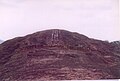 Sloping parallel slots cut in the rock.