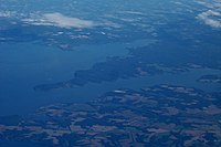 Oblique air photo showing the Elk River in foreground emptying into the Chesapeake Bay