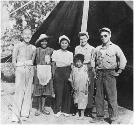 Guy Gabaldon (right) poses in a group that includes Japanese prisoners in 1944