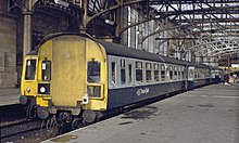 A Class 126 train in British Rail blue and grey with "Trans-Clyde" branding Glasgow Central Cravens split code end Class 126 and Class 107.jpg