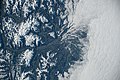 Blick von oben auf die Gebirgsstöcke mit Königssee, unten im Foto der nahe Wolfgangsee, → ISS photo)