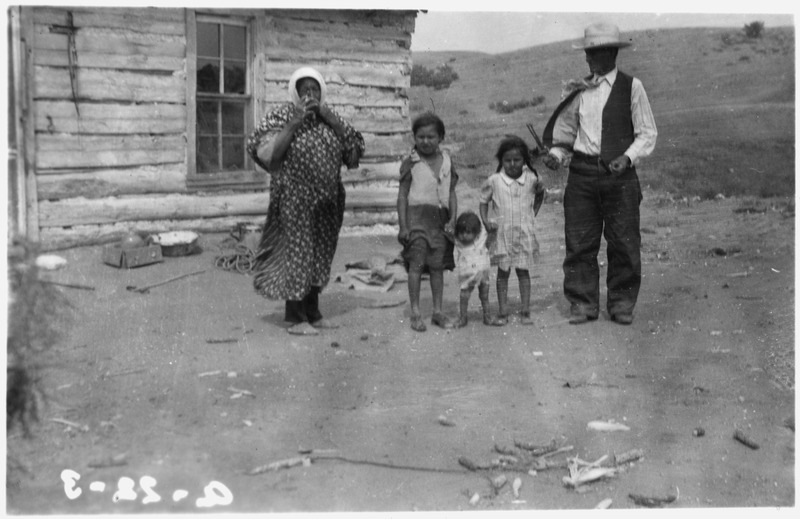 File:Indian family standing in front of log house - NARA - 285667.tif