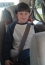 Child in a booster seat Jacobstarriser.jpg