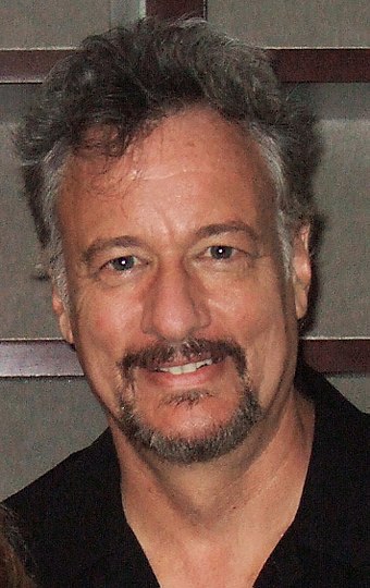 John de Lancie plays the role of the mysterious but powerful alien known as Q. Like many actors in the series, he also worked on some of the video games of the period.