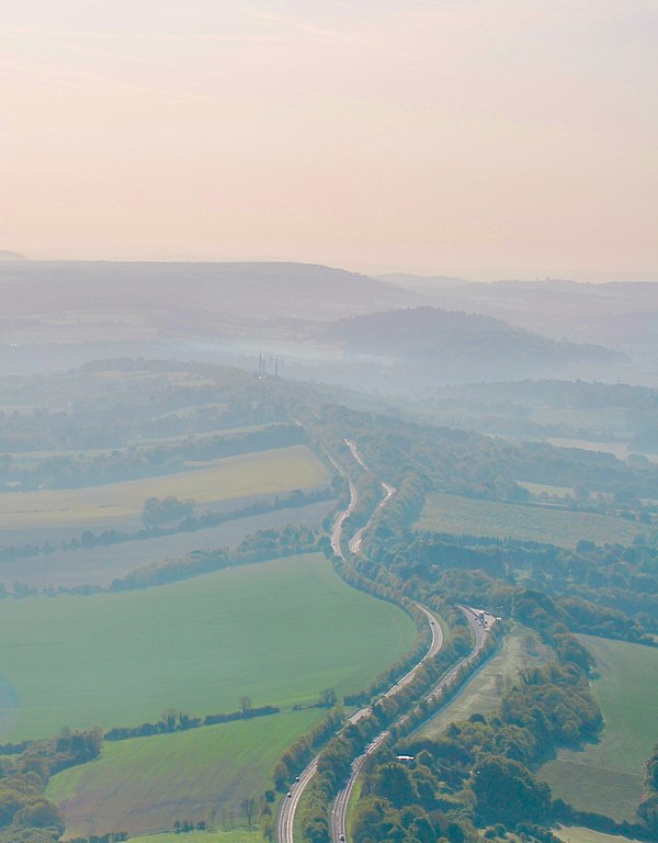 Aerial photograph of the Hog's Back, looking east towards Guildford. The A31 dual carriageway runs along the spine of the ridge.