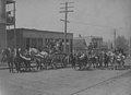 Man in horse-drawn wagons on a street, possibly a parade, September 4, 1905 (PEISER 220).jpg