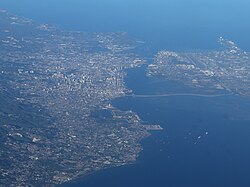 Aerial view of Metro Cebu in 2023. To the left is Cebu City, to the right is Mactan.