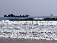 An oil barge and Platform Holly in 2007, seen from Ellwood Beach Platform Holly and oil barge.jpg