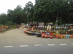 Pots displayed along the Trans–West African Coastal Highway at Vume