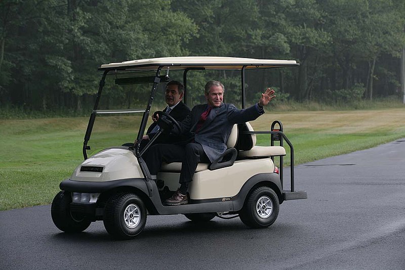 File:President George W. Bush Waves as He Drives a Golf Cart with Prime Minister Gordon Brown of the United Kingdom at Camp David.jpg