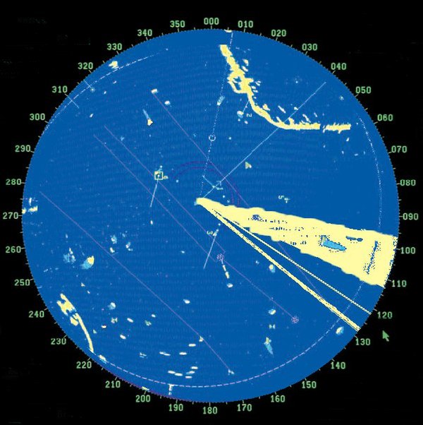 Simulated radar screen in US Navy training exercise showing simulated jamming (triangular white area lower right)