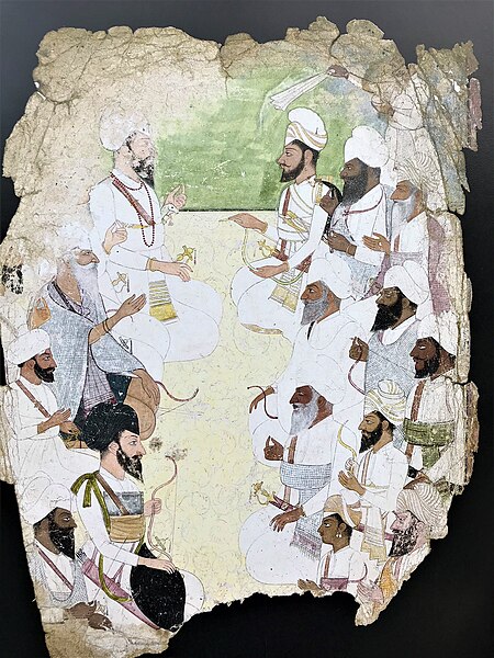 Ramgarhia and Sukarchakia Misls hold a diplomatic meeting. Jassa Singh Ramgarhia (long, white beard) on left. Maha Singh with checked blanket covering
