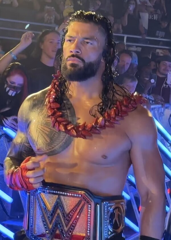 Roman Reigns with the Undisputed WWE Universal Championship belt (2023–present), which represents both the WWE and Universal Championships.