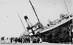 Thumbnail for File:StateLibQld 1 127775 Brodland (ship) listing severely at dock.jpg