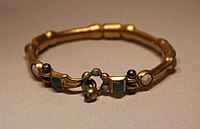 Gold bracelet from the tomb, probably imported from India. National Museum of China
