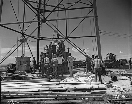 Nuclear Gadget being raised to the top of the detonation "shot tower", at Alamogordo Bombing Range; Trinity nuclear test, New Mexico, July 1945
