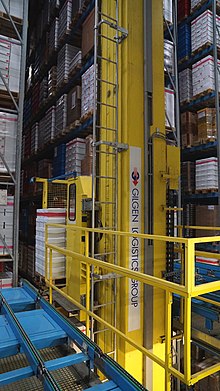 A pallet is automatically removed from the high-bay warehouse.