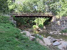 Bridge over Four Mile Run in Glencarlyn Park south of Arlington Boulevard (U.S. Route 50) (July 2020) W&OD Trail Glencarlyn Park 1st crossing 2020.jpg