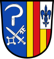 Gemeinde Antdorf Gespalten; vorne in Blau unter einer silbernen Sichel schräg gekreuzt ein silbernes Schwert und ein silberner Schlüssel, hinten dreimal gespalten von Gold und Rot, im linken silbernen Obereck eine blaue heraldische Lilie.