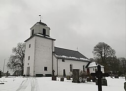 Östad kyrkas sydvästra sida i december 2023.