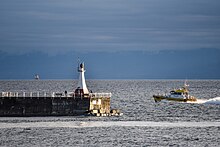 Pilot boat rounding Ogden Point Breakwater Lighthouse and heading out to a ship at Brotchie Pilot Boarding Station. 2021-11-19 03 PACIFIC GUARDIAN (Transport Canada Vessel Registration - 844850.jpg